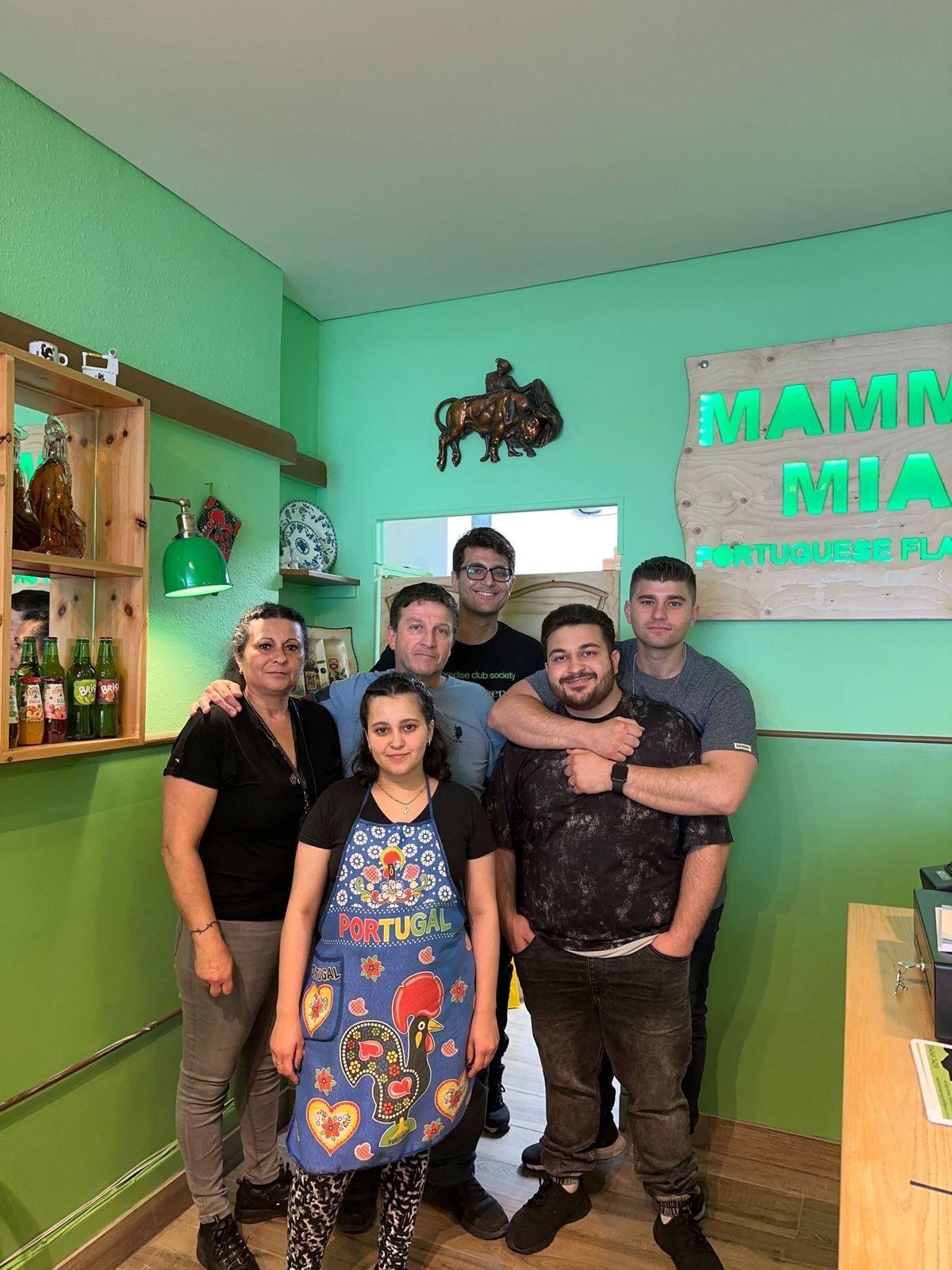 The Mamma Mia family together inside the restaurant