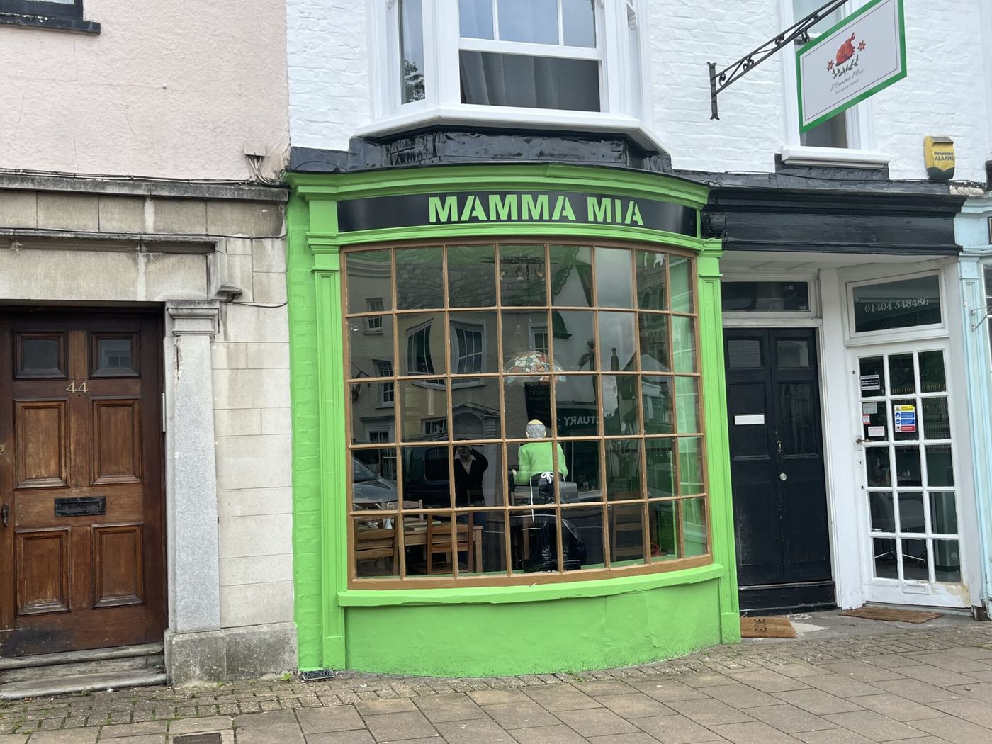 Mamma Mia’s bright green bay-window shopfront on Honiton High Street